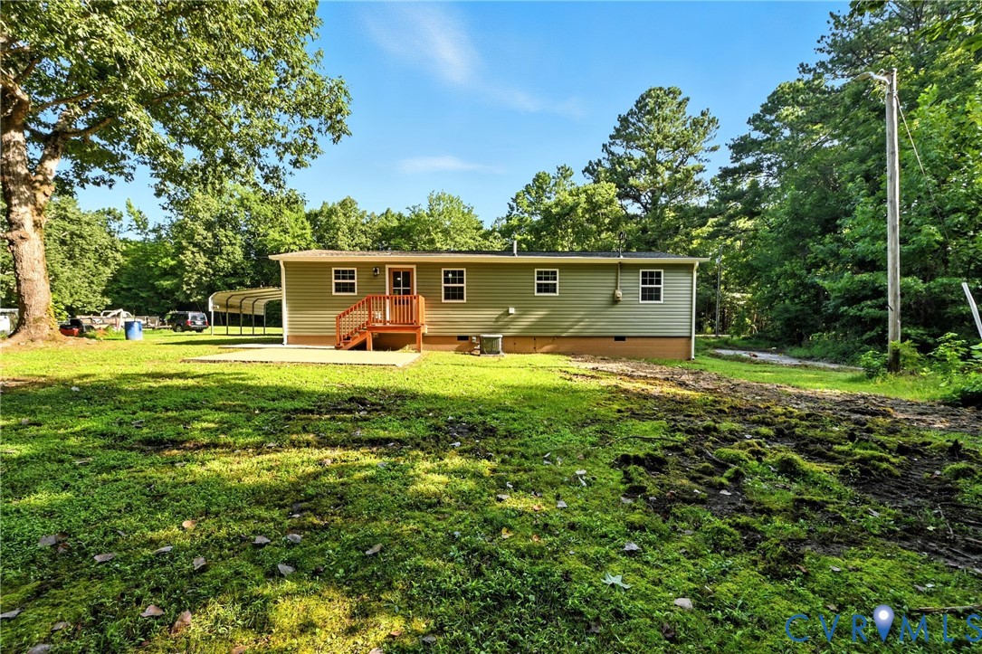 24611 Williamson Road Dinwiddie, VA 23841 - Photo 27 of 34 Rear view of property featuring crawl space, a law