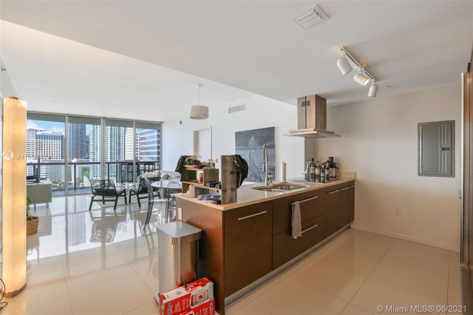 495 Brickell Avenue, Unit 2103 Miami, FL 33131 - Photo 11 of 43 a living room with furniture a dining table and chairs