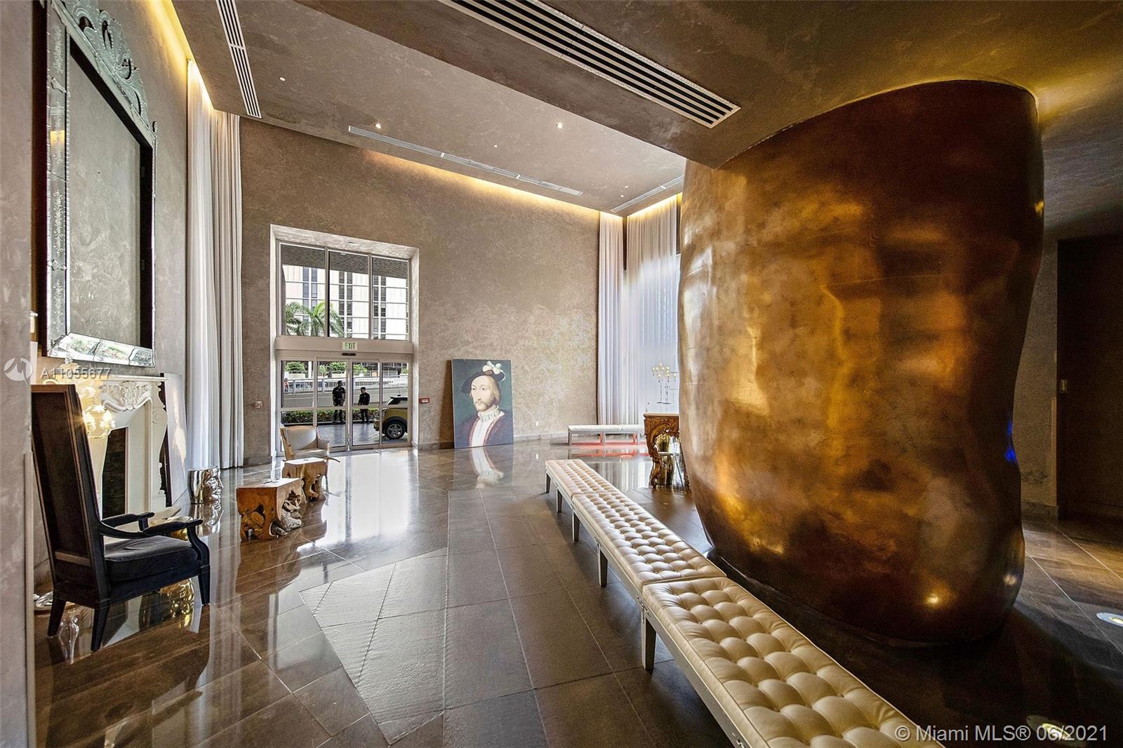 495 Brickell Avenue, Unit 2103 Miami, FL 33131 - Photo 32 of 43 a lobby with furniture and floor to ceiling window