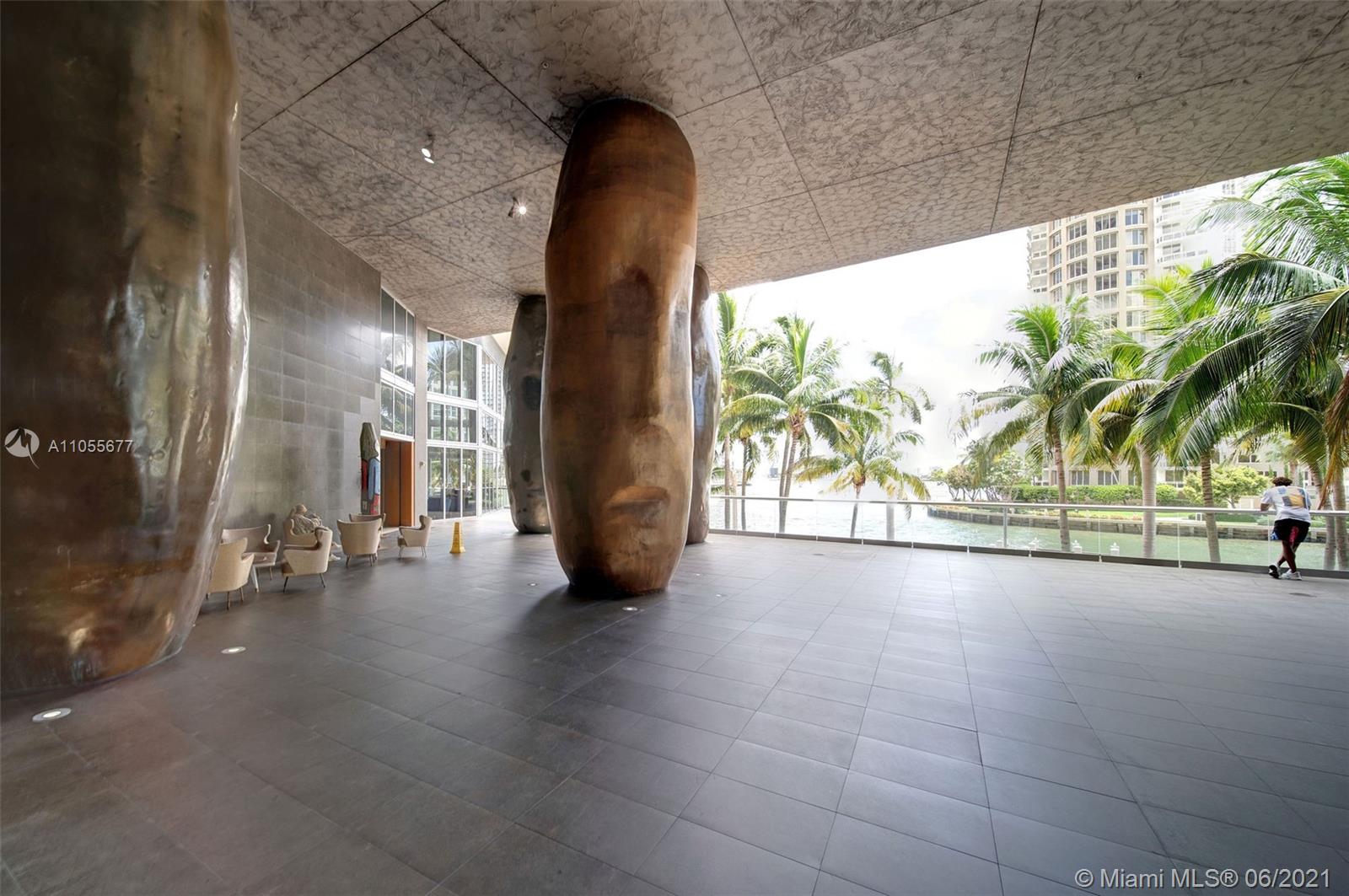 495 Brickell Avenue, Unit 2103 Miami, FL 33131 - Photo 34 of 43 a view of hallway with wooden floor and a potted plant