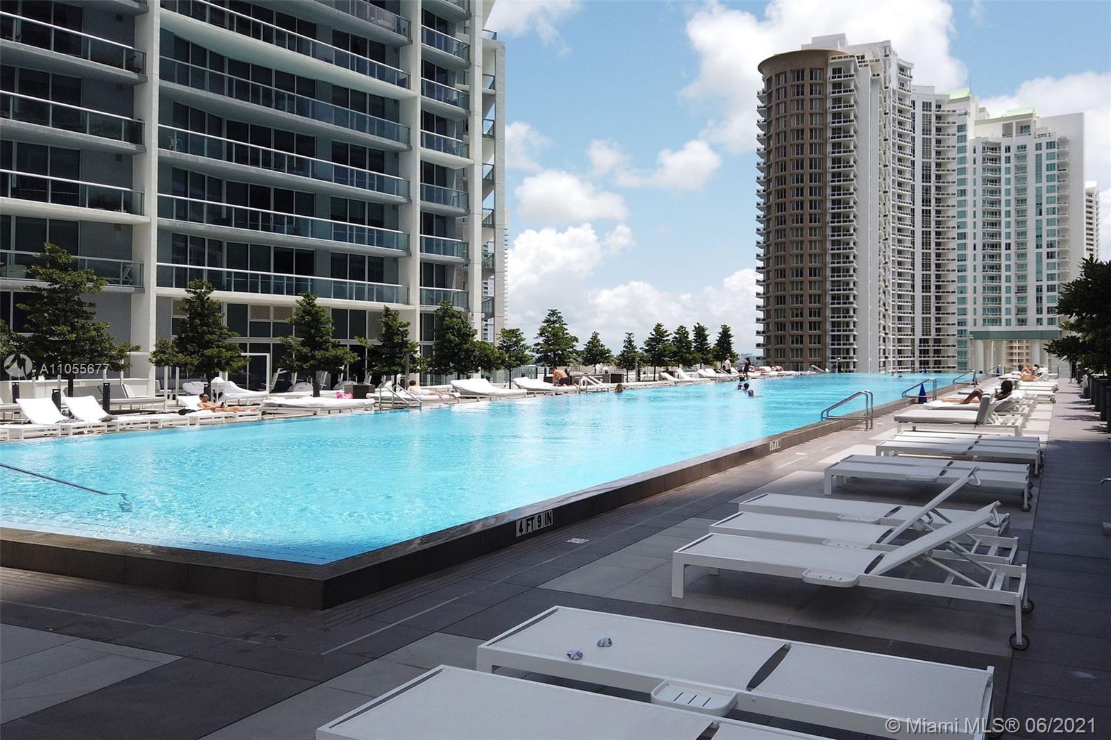 495 Brickell Avenue, Unit 2103 Miami, FL 33131 - Photo 43 of 43 a view of swimming pool with outdoor seating and lake view