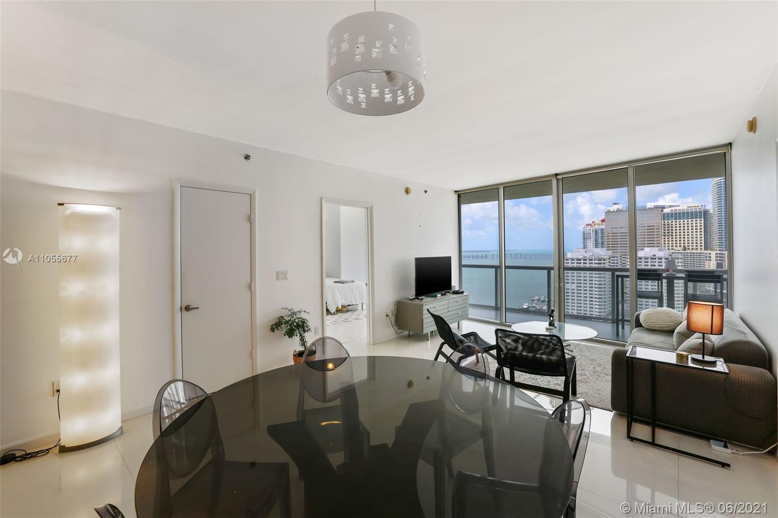 495 Brickell Avenue, Unit 2103 Miami, FL 33131 - Photo 7 of 43 a living room with furniture and a large window