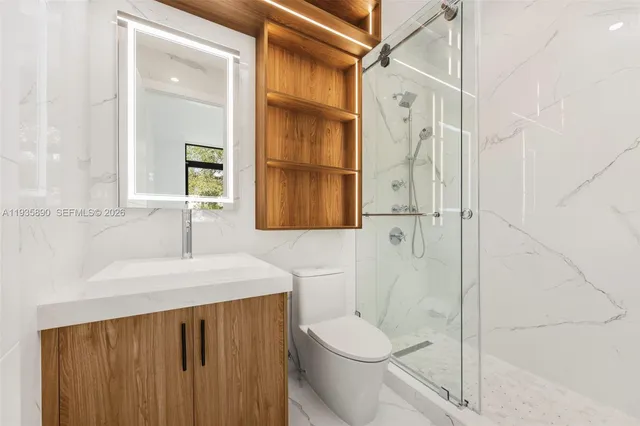 a view of balcony with wooden floor and fence