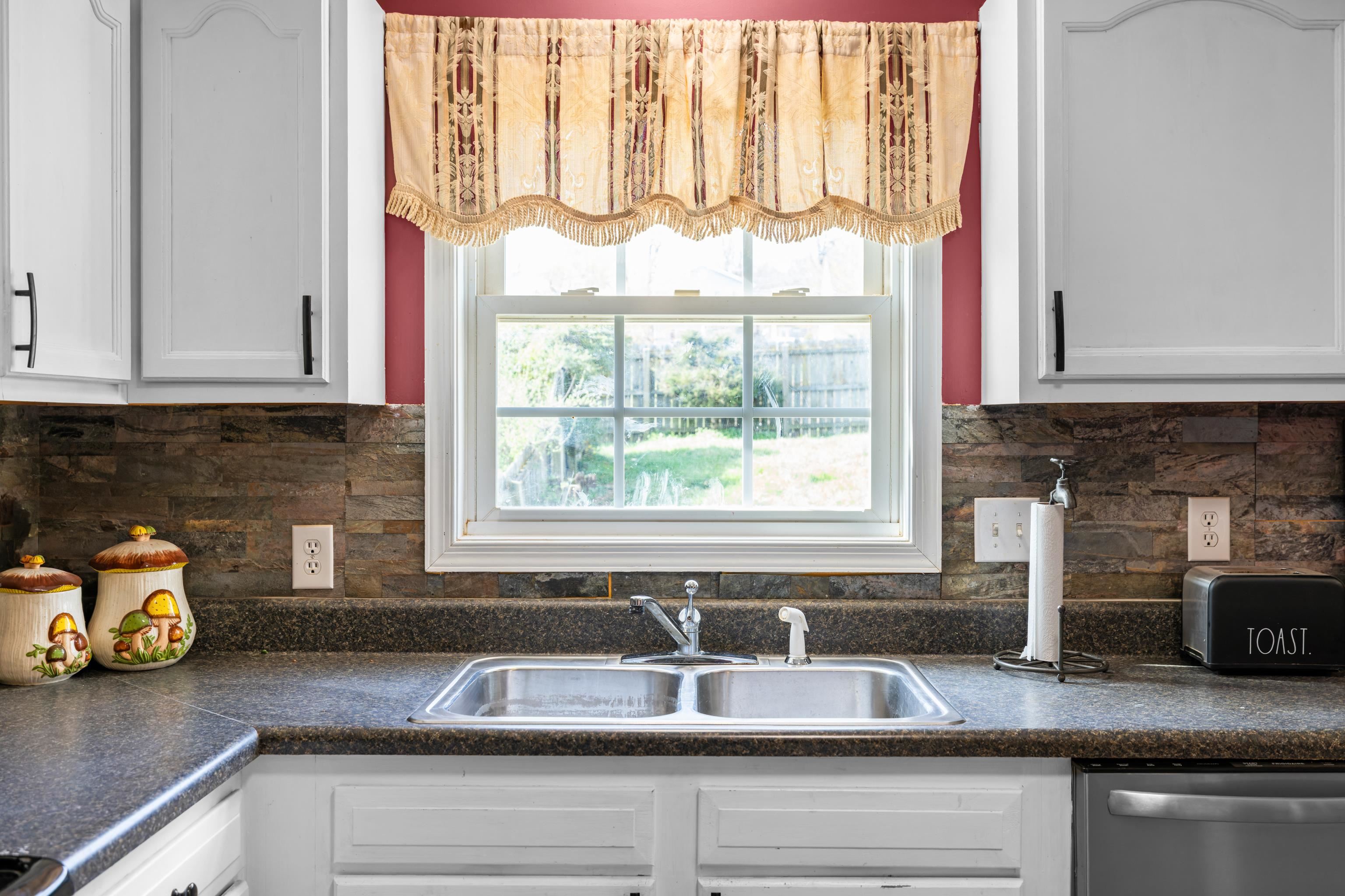 1520 3rd Street Waynesboro, VA 22980 - Photo 18 of 55 a kitchen with granite countertop a sink and a window