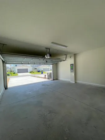 a view of kitchen and refrigerator