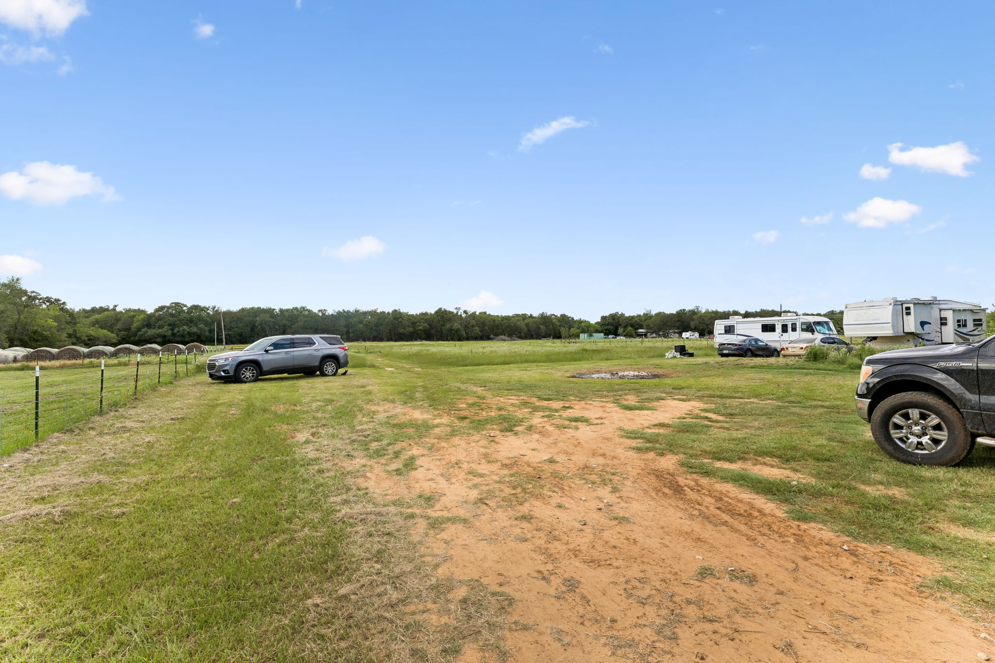 253 North County Line Road, Unit C Elgin, TX 78621 - Photo 29 of 39 A vast, open field with ample space for agricultural pursuits or recreational vehicles.