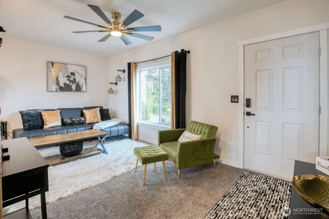 a living room with furniture and a window