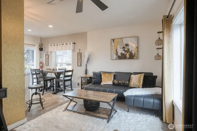 a living room with furniture and a large window