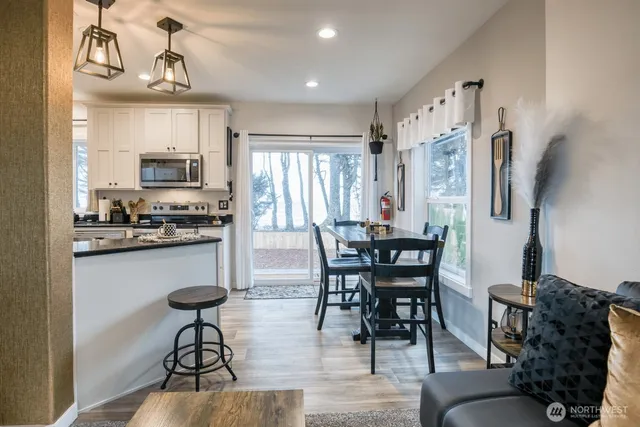 a view of a dining room with furniture window and wooden floor