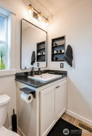 a bathroom with a sink and a mirror