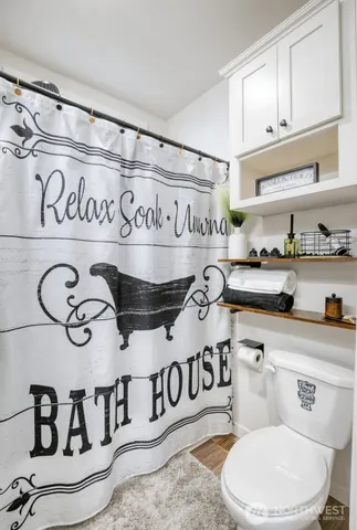 a bathroom with a toilet and a sink