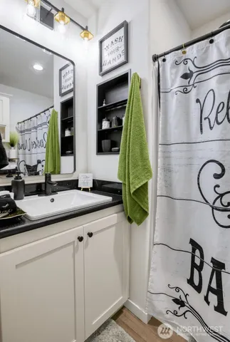 a bathroom with a sink and a mirror