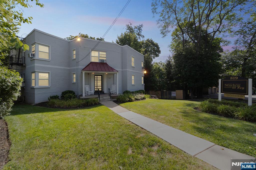 819 Bloomfield Avenue, Unit 10 Montclair, NJ 07042 - Photo 1 of 8 a front view of a house with yard and green space