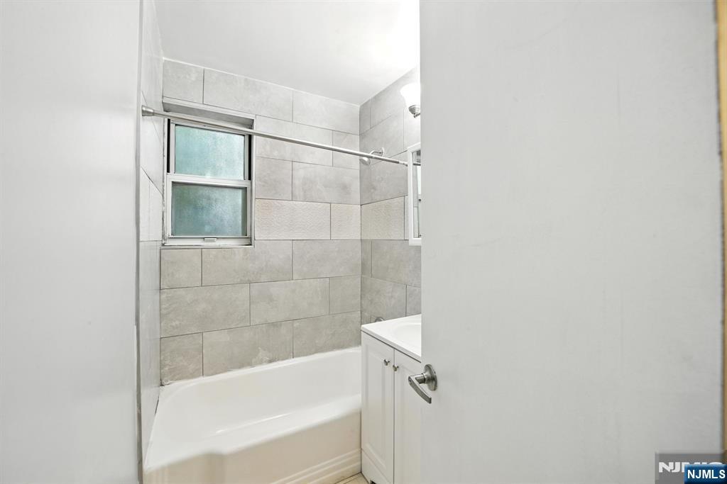 819 Bloomfield Avenue, Unit 10 Montclair, NJ 07042 - Photo 7 of 8 a bathroom with a bathtub