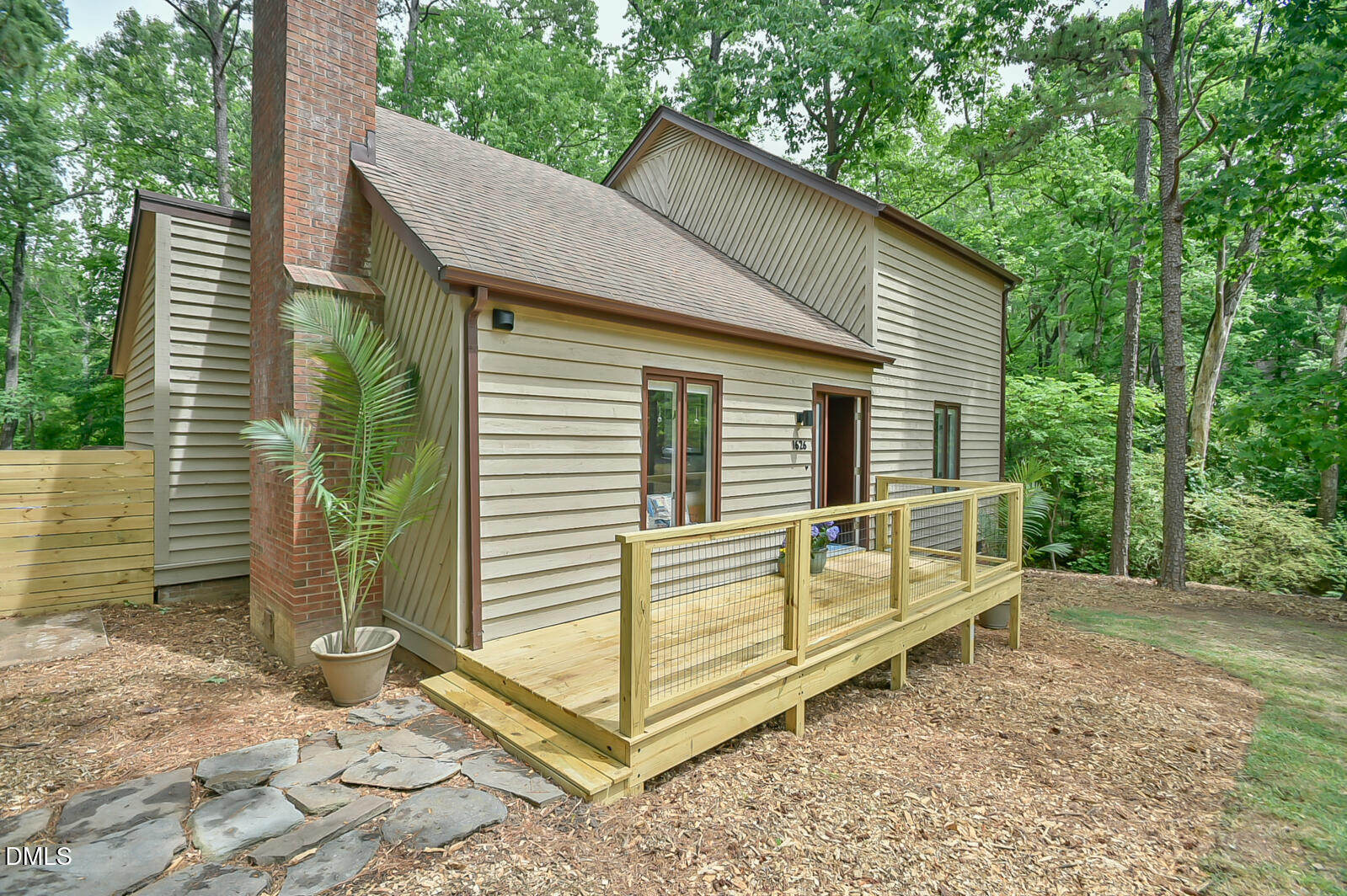 1626 Rowemont Drive Durham, NC 27705 - Photo 1 of 45 a view of a house with a wooden fence