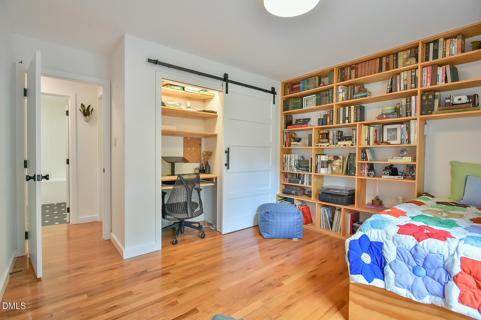 1626 Rowemont Drive Durham, NC 27705 - Photo 15 of 45 a bedroom with furniture and a book shelf