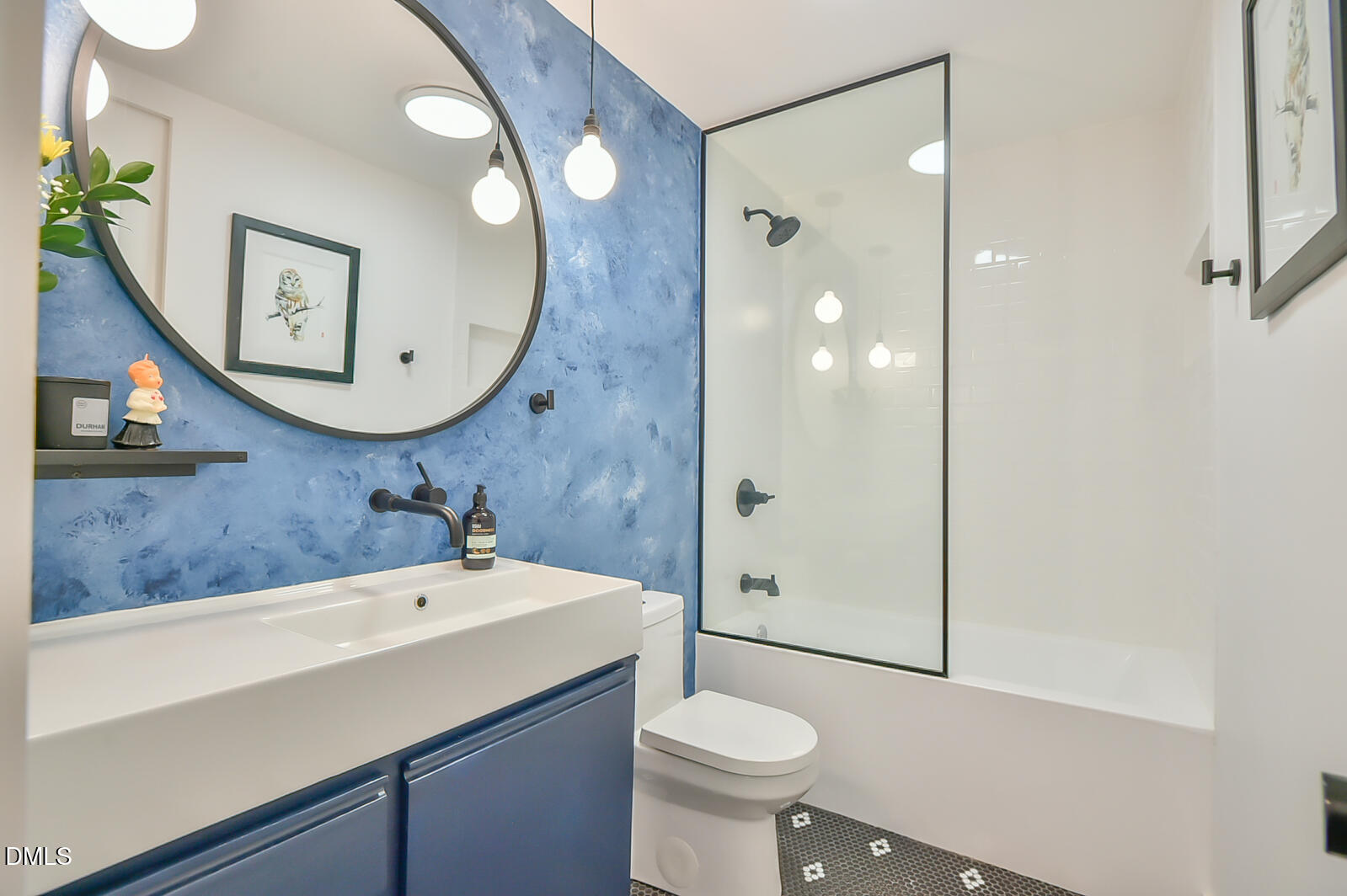 1626 Rowemont Drive Durham, NC 27705 - Photo 16 of 45 a bathroom with a sink a toilet and shower
