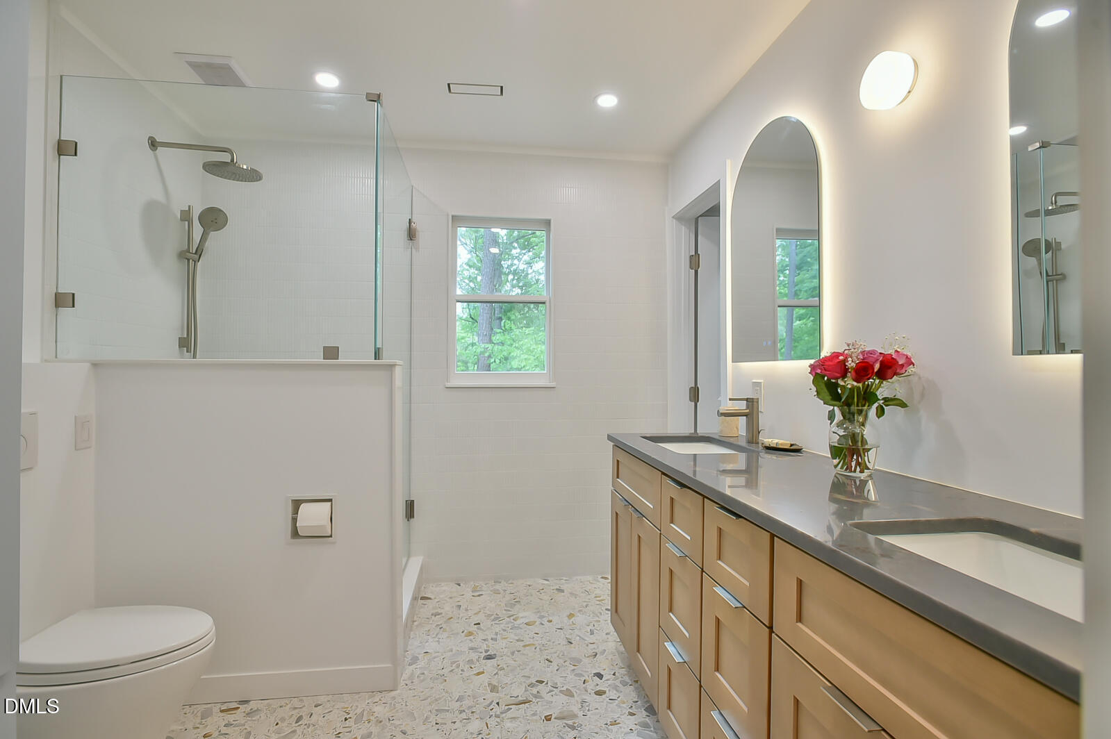 1626 Rowemont Drive Durham, NC 27705 - Photo 21 of 45 a bathroom with a granite countertop sink a toilet and a mirror