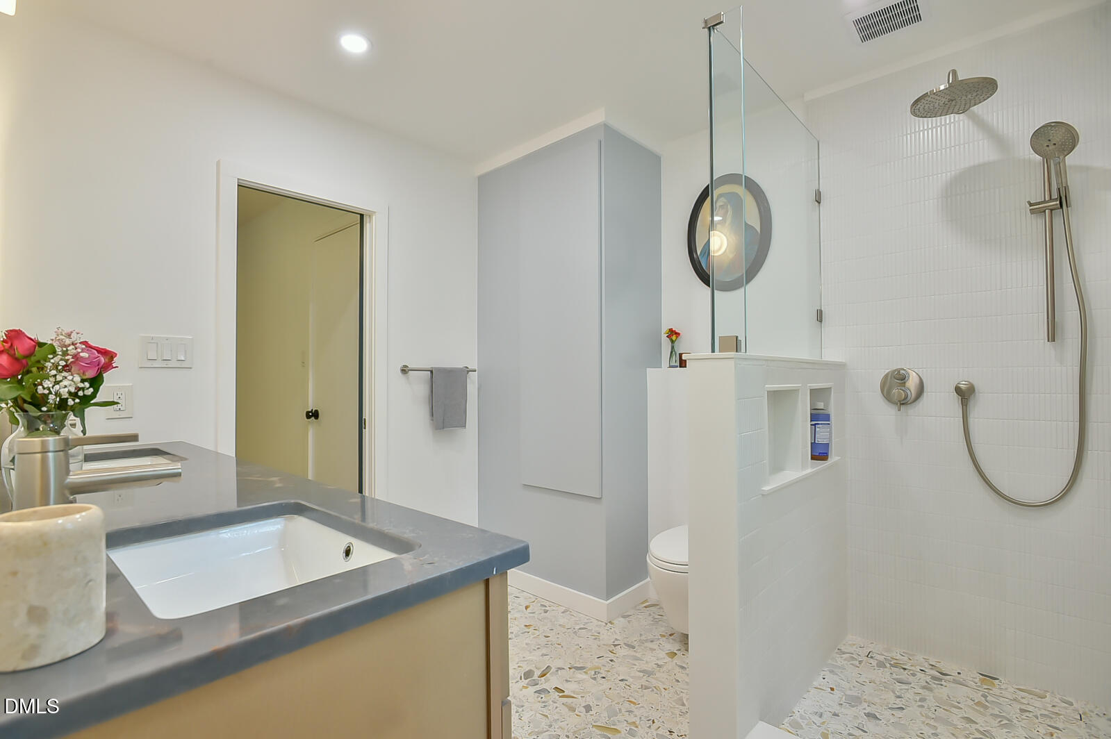1626 Rowemont Drive Durham, NC 27705 - Photo 23 of 45 a bathroom with a granite countertop sink a mirror and shower