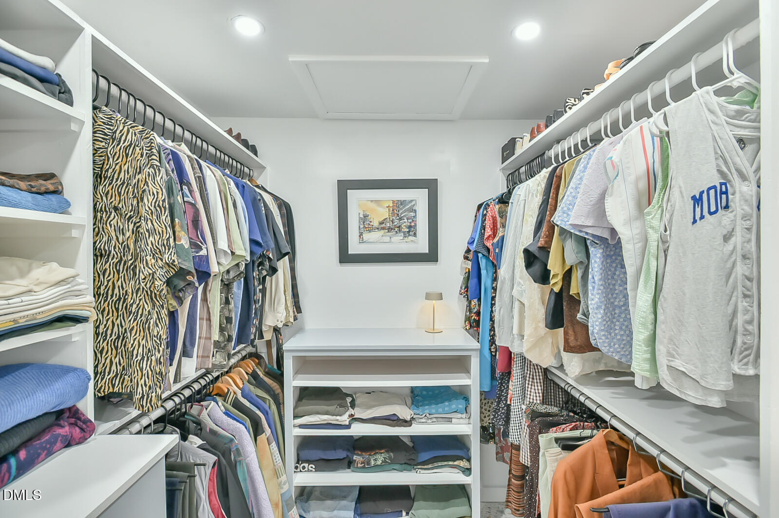 1626 Rowemont Drive Durham, NC 27705 - Photo 25 of 45 a view of walk in closet with clothes and shoes
