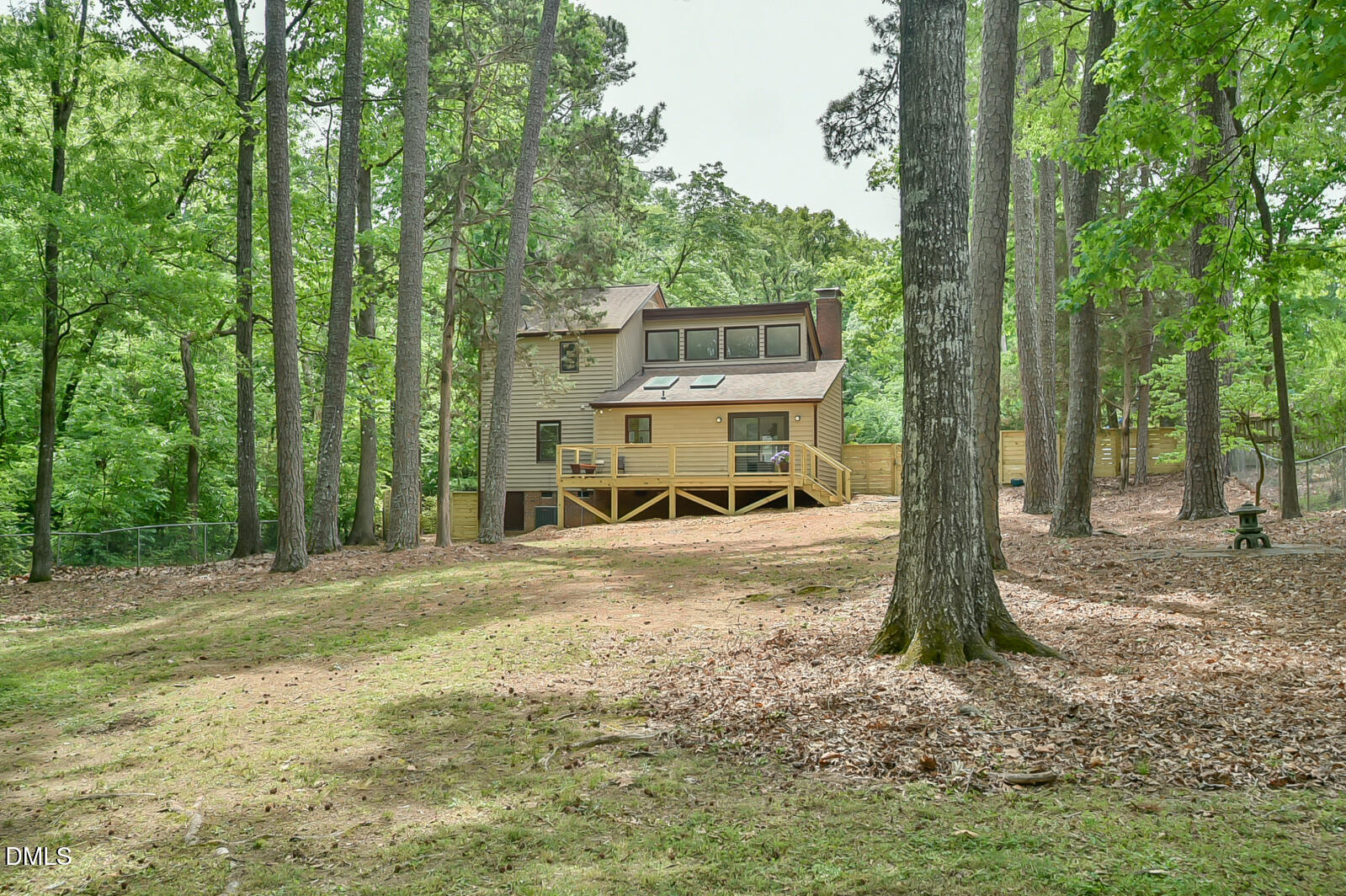 1626 Rowemont Drive Durham, NC 27705 - Photo 29 of 45 a view of a house with backyard and trees