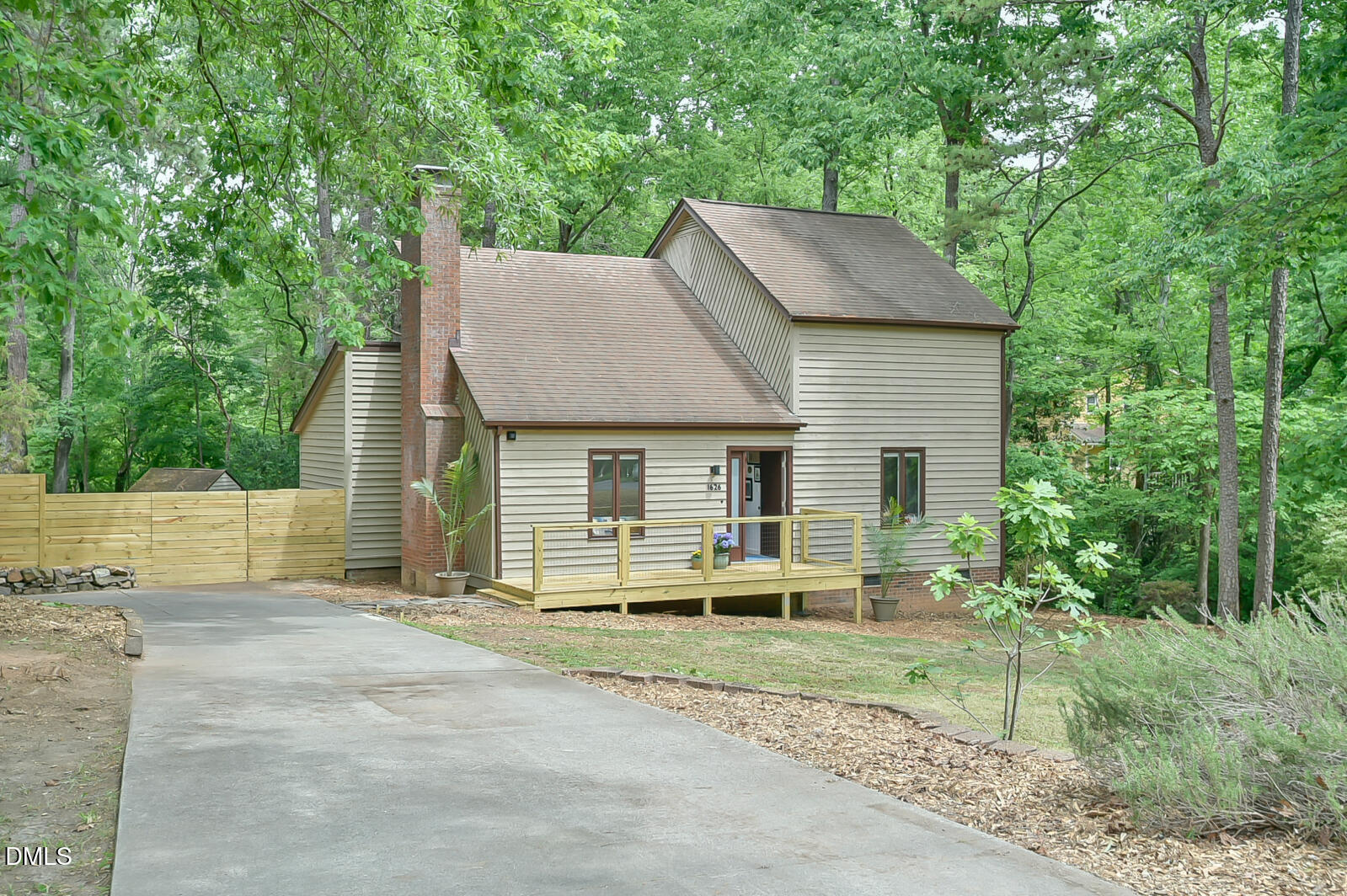 1626 Rowemont Drive Durham, NC 27705 - Photo 30 of 45 a front view of a house with a yard and garage
