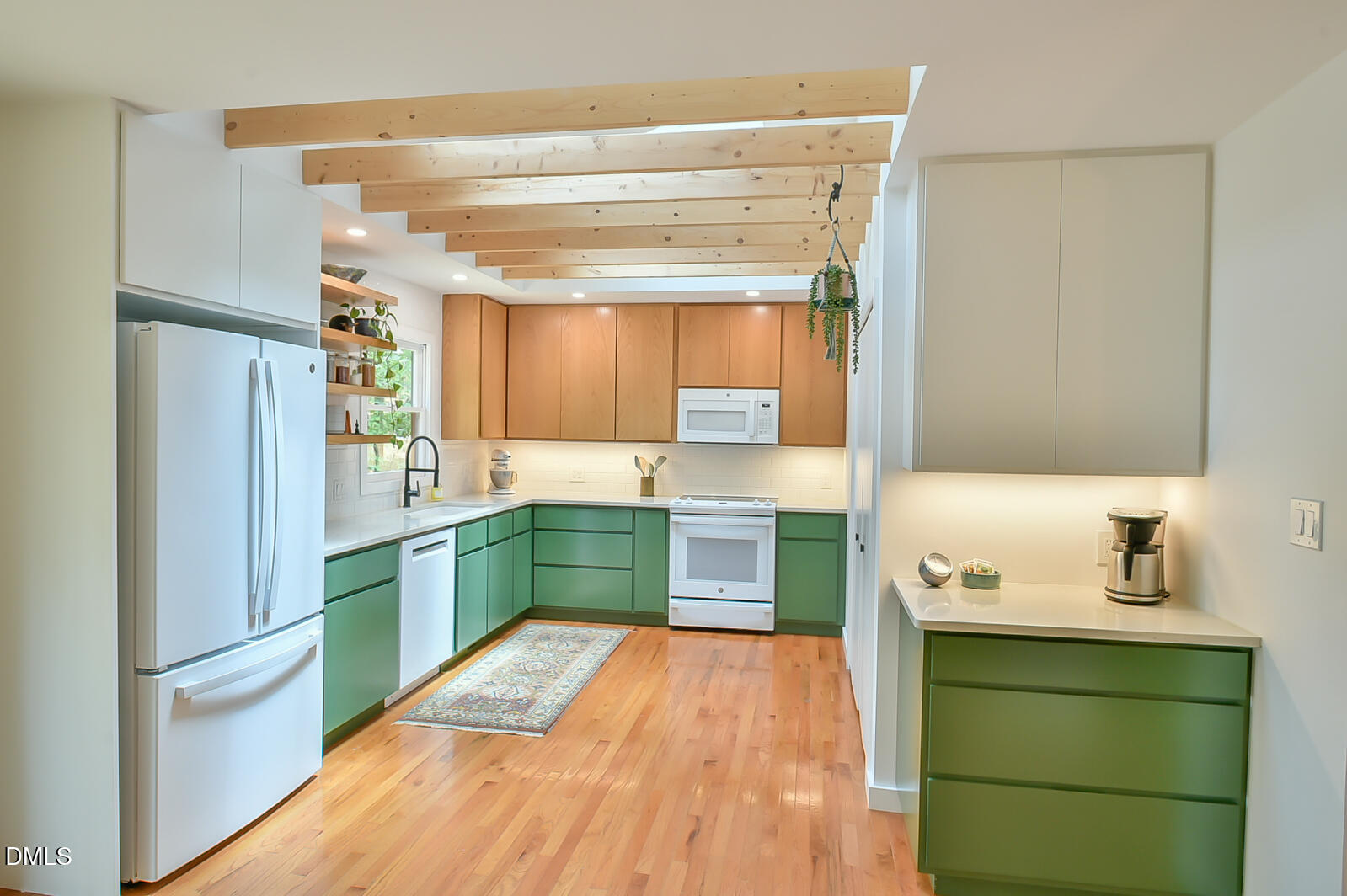1626 Rowemont Drive Durham, NC 27705 - Photo 9 of 45 a kitchen with a refrigerator and a sink