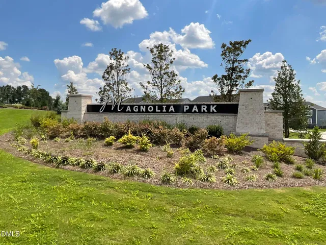 a view of a water with a fountain in the yard