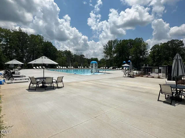 a view of parked cars parked on the side of a street
