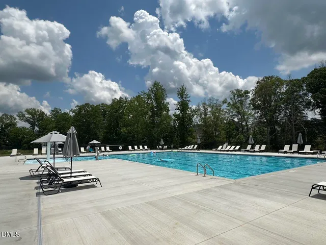 a view of outdoor space with playground and green space