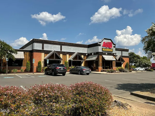 a view of a cars parked in front of a building