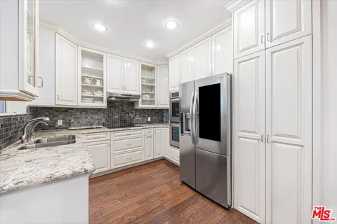a spacious bathroom with a bathtub shower sink mirror and toilet