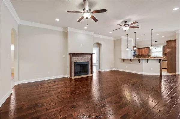 a view of a kitchen with a stove cabinets and wooden floor