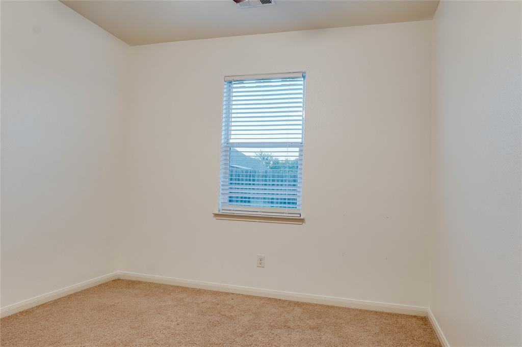 1232 Switchgrass Lane Crowley, TX 76036 - Photo 16 of 31 a view of a small space with a window