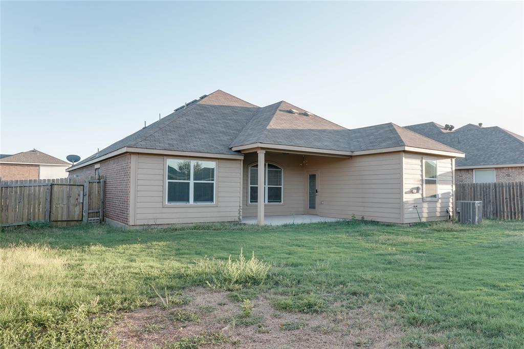 1232 Switchgrass Lane Crowley, TX 76036 - Photo 23 of 31 a view of a house with yard and a fence