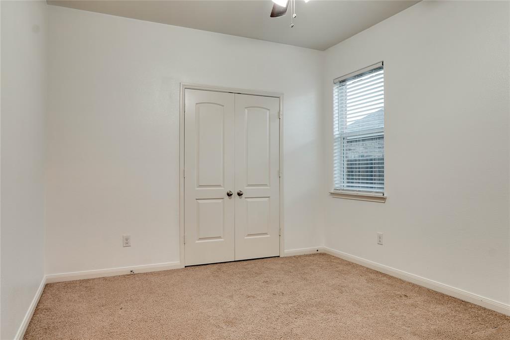 1232 Switchgrass Lane Crowley, TX 76036 - Photo 28 of 31 an empty room with windows