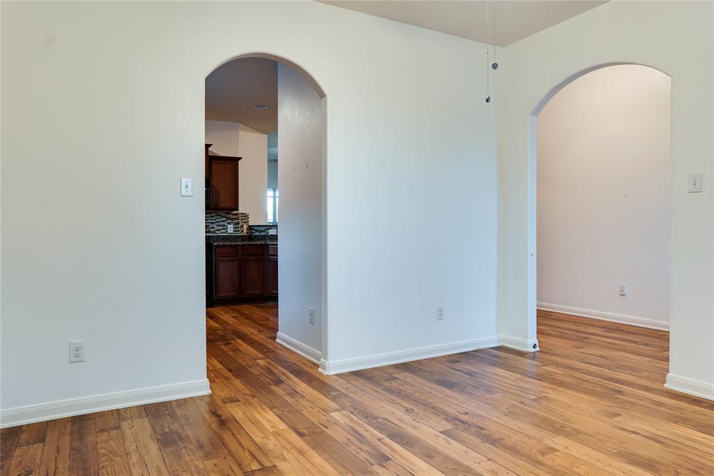 1232 Switchgrass Lane Crowley, TX 76036 - Photo 7 of 31 a view of a room with wooden floor