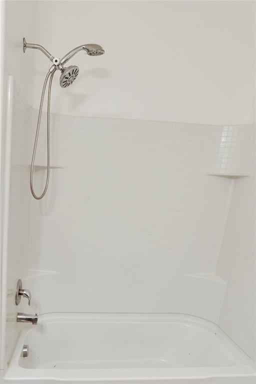 1232 Switchgrass Lane Crowley, TX 76036 - Photo 8 of 31 a bathroom with a bath tub with a shower