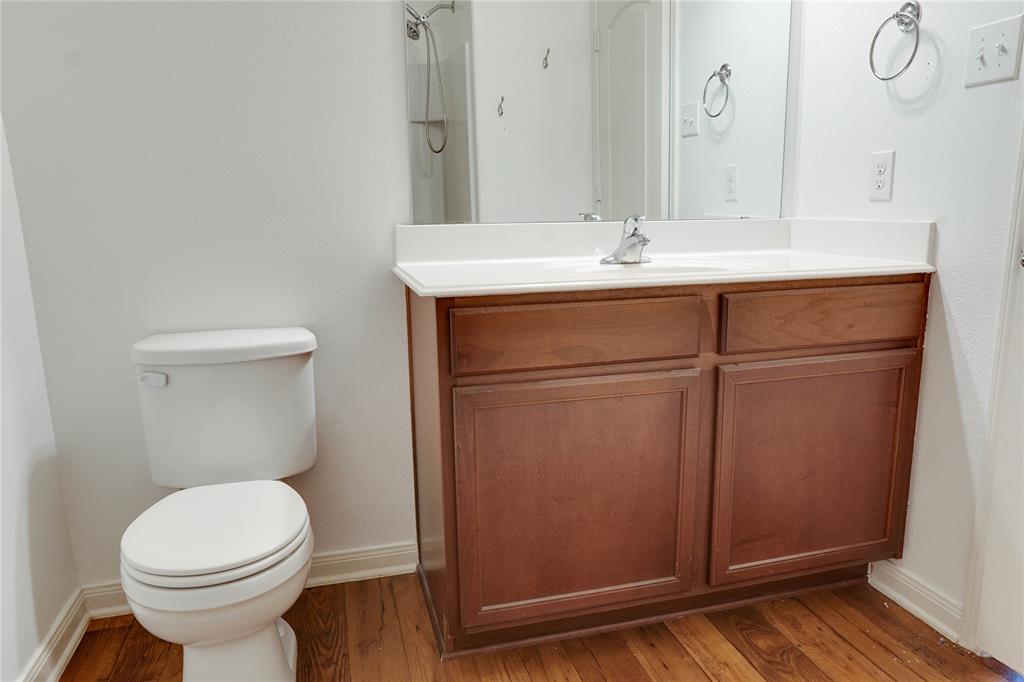 1232 Switchgrass Lane Crowley, TX 76036 - Photo 9 of 31 a bathroom with a sink a toilet and mirror