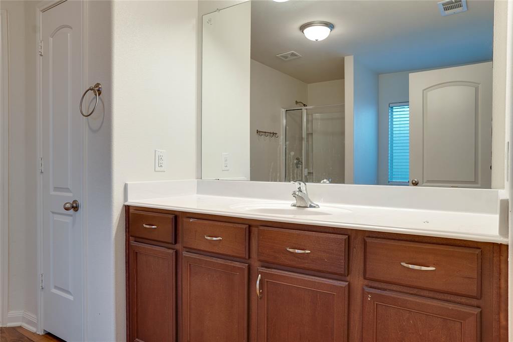 1232 Switchgrass Lane Crowley, TX 76036 - Photo 10 of 31 a bathroom with a double vanity sink and mirror