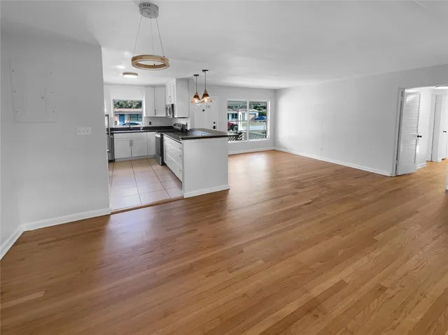 a view of kitchen with wooden floor