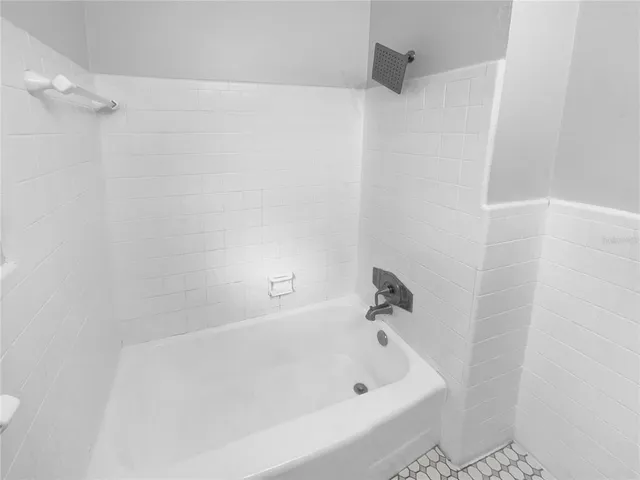 a bathroom with a white bath tub