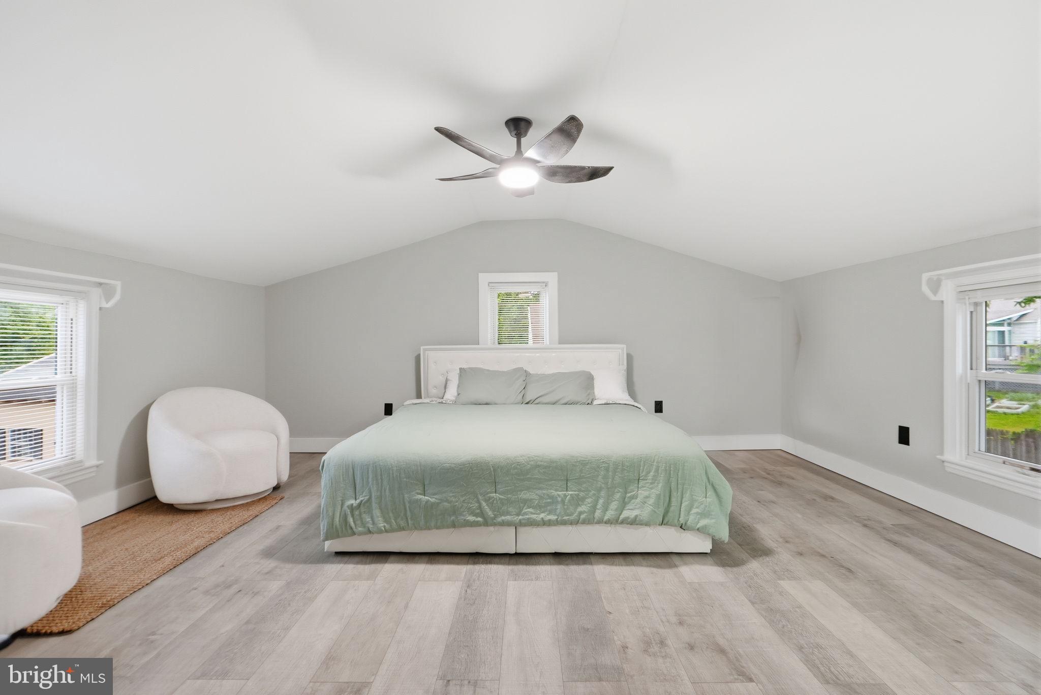 5906 Berwyn Road College Park, MD 20740 - Photo 15 of 46 a bedroom with a bed and a window