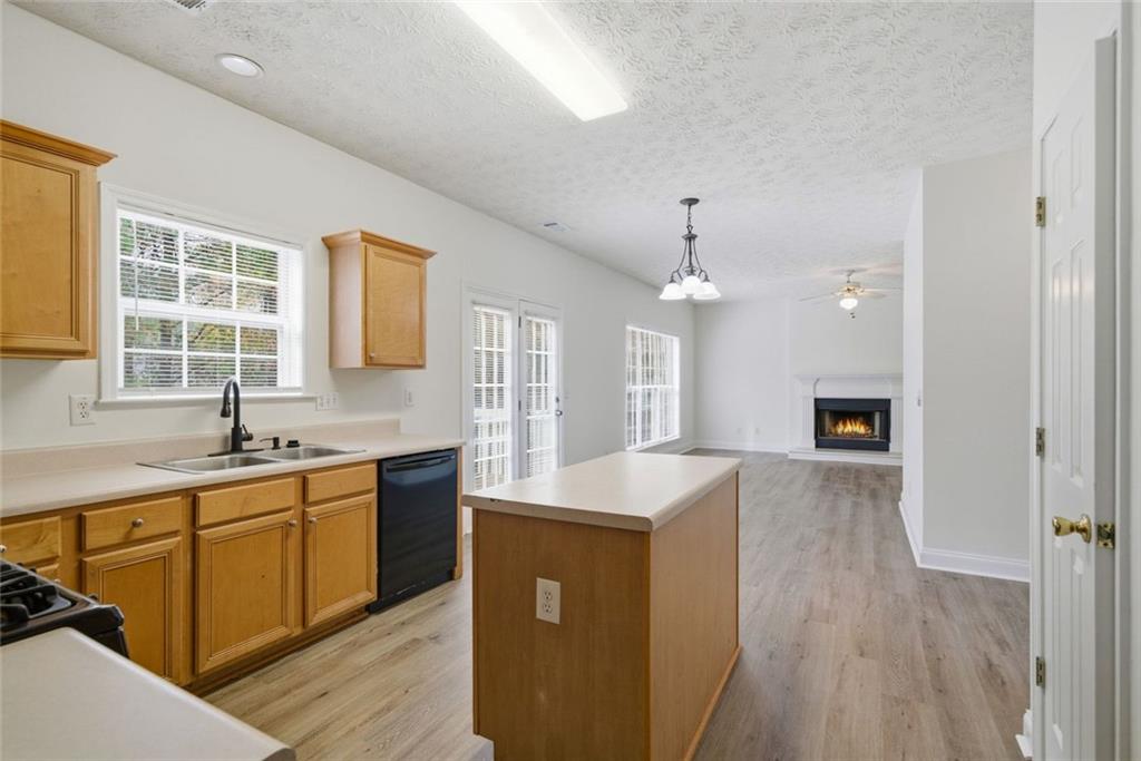 2254 Caneridge Trail Southwest Marietta, GA 30064 - Photo 13 of 30 a kitchen with stainless steel appliances granite countertop a sink stove and refrigerator