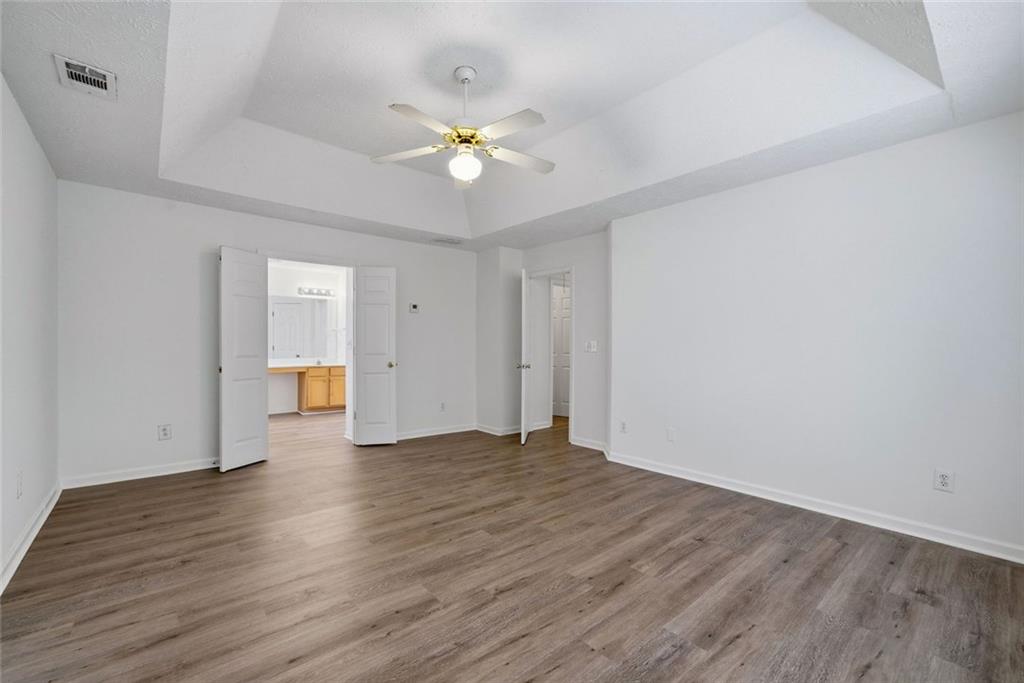 2254 Caneridge Trail Southwest Marietta, GA 30064 - Photo 17 of 30 a view of an empty room with wooden floor and a window