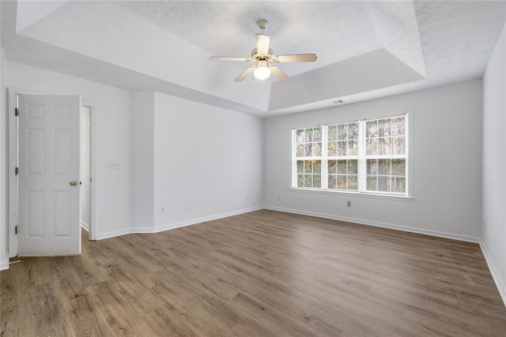 2254 Caneridge Trail Southwest Marietta, GA 30064 - Photo 21 of 30 a view of an empty room with wooden floor and a window