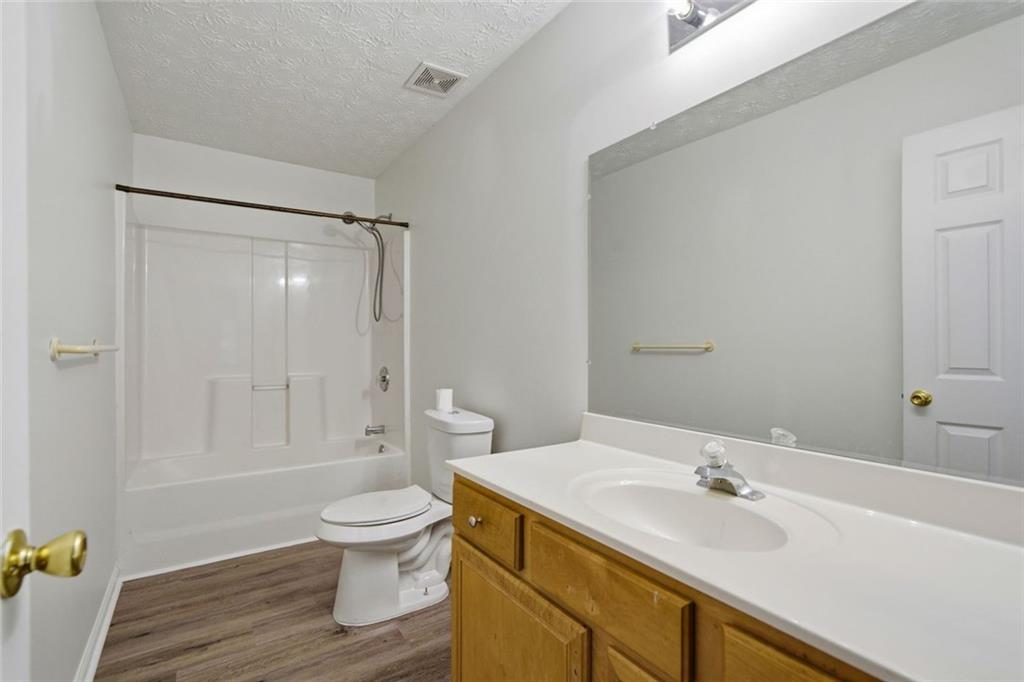 2254 Caneridge Trail Southwest Marietta, GA 30064 - Photo 25 of 30 a bathroom with a sink toilet and shower
