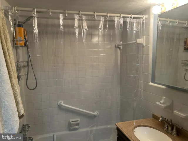 a bathroom with a shower and toilet