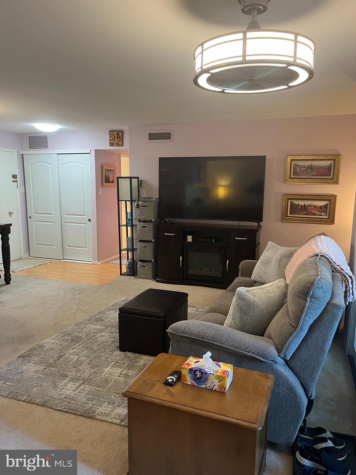 1610 The Fairway, Unit 104W Jenkintown, PA 19046 - Photo 3 of 14 a living room with furniture and a flat screen tv