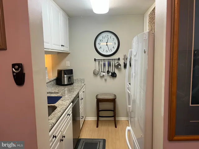 a view of a hallway with washer and dryer